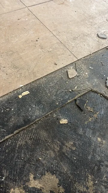 Black bitumen mastic floor removal in a SE7 flat